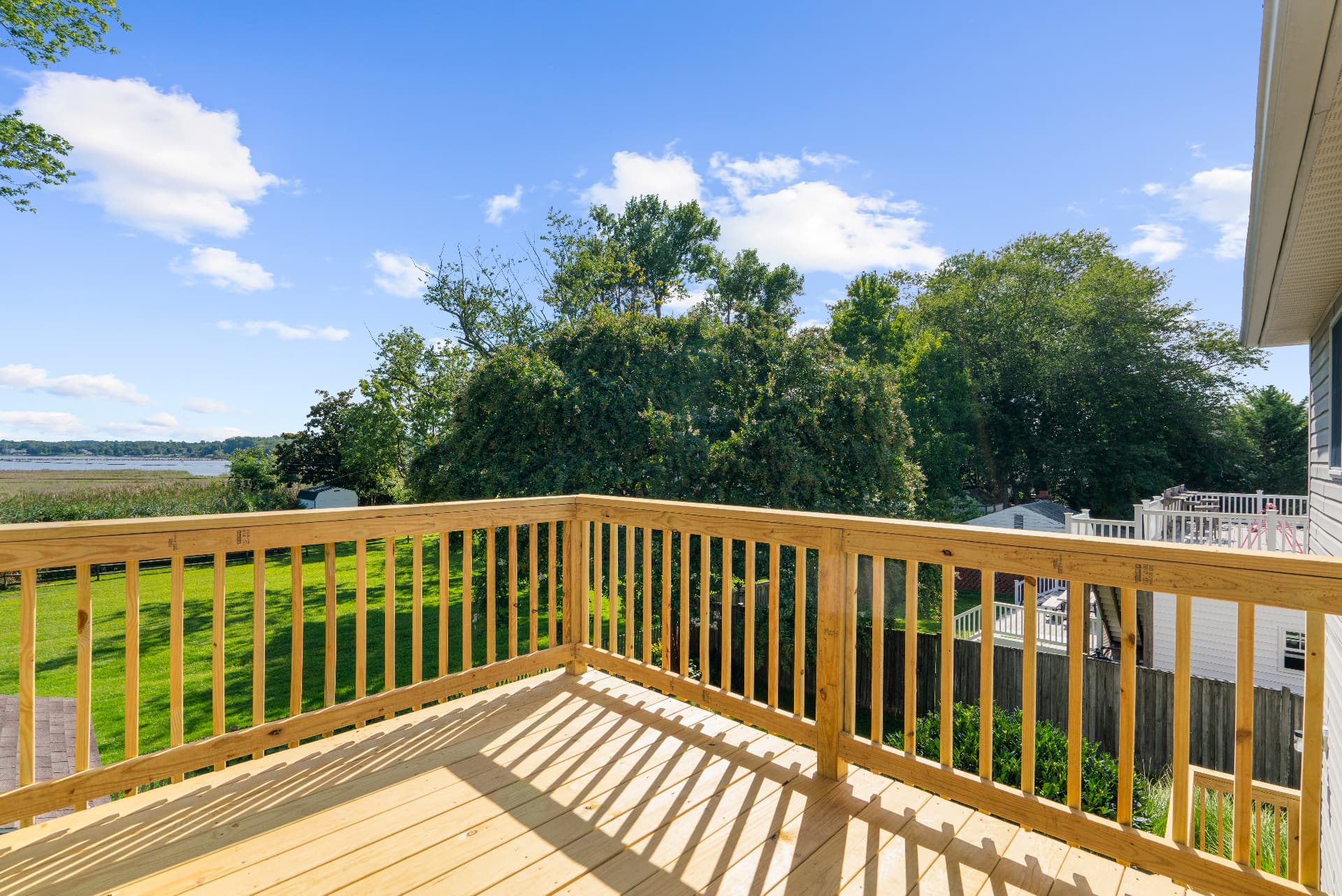 Private primary-suite deck overlooking the water