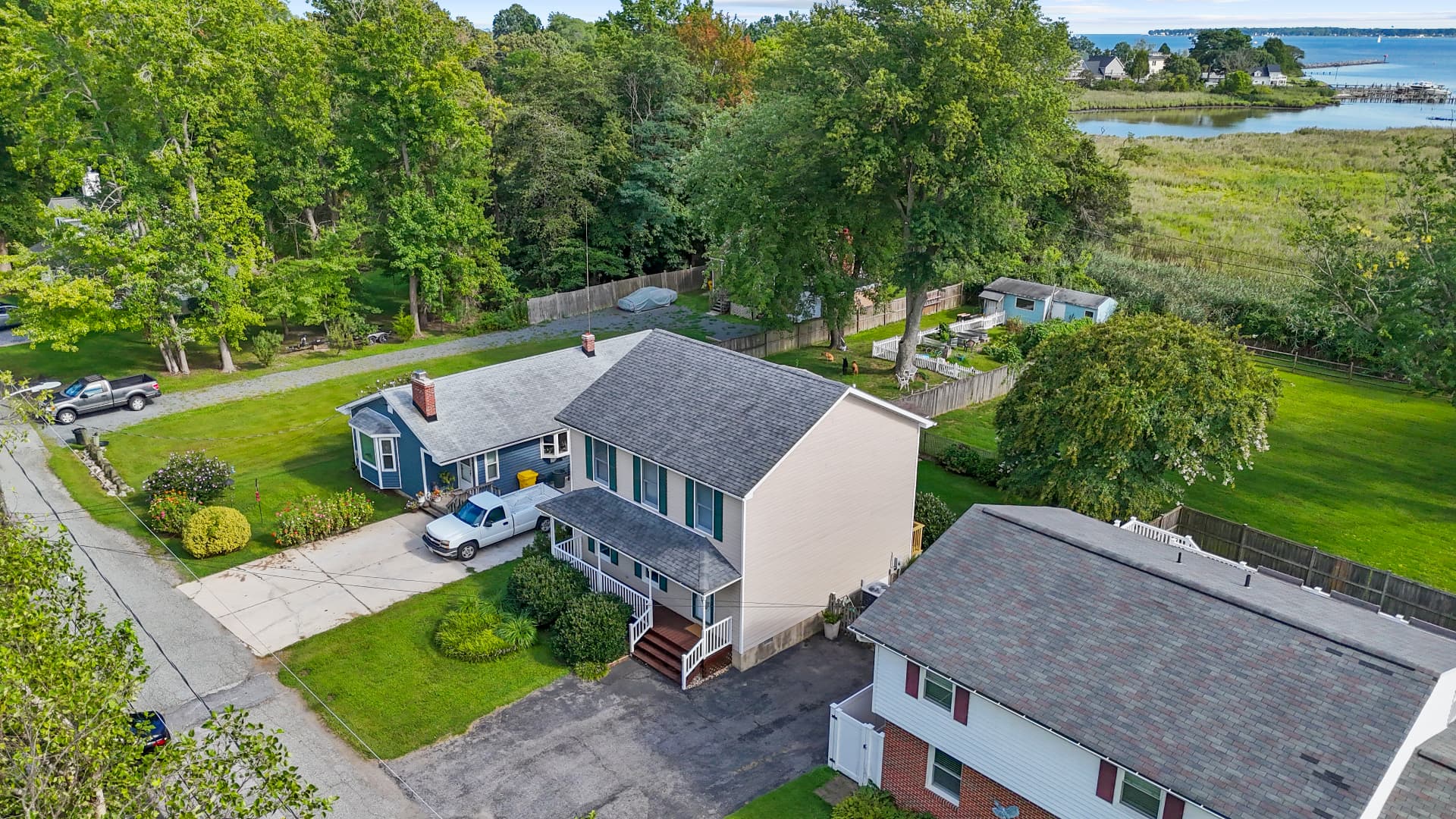 Aerial view of 611 Marshall St with Herring Bay beyond